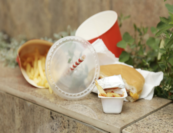 A pile of fast food garbage stacked on top of its self
