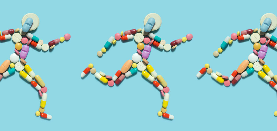 Three people made of pills in running formation