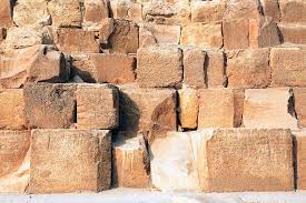 Close-up photograph of the limestone blocks of the Great Pyramid of Khufu at Giza