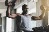 man lifting dumbbells for strength