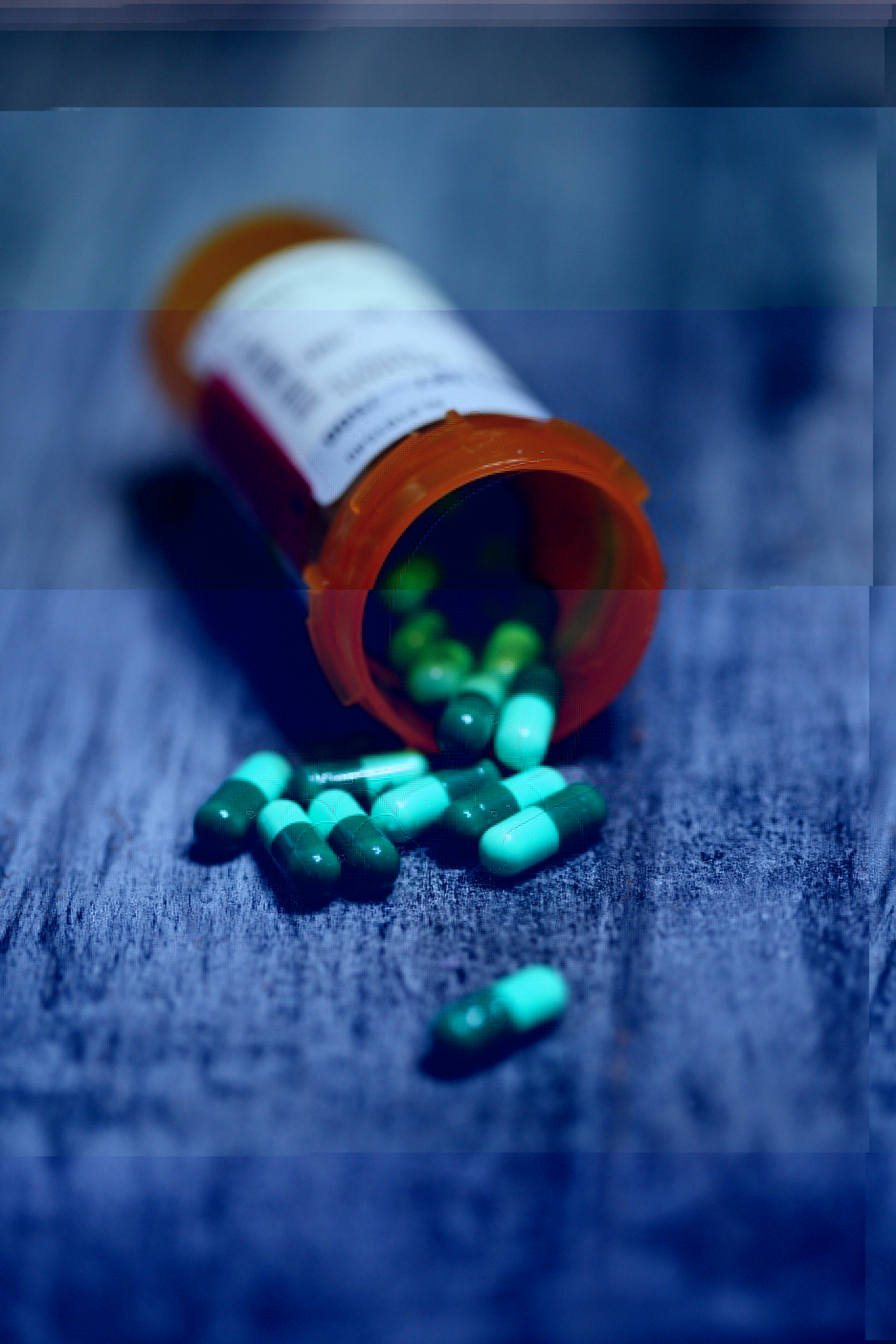 Prescription medication bottles representing stimulant and non-stimulant ADHD treatments
